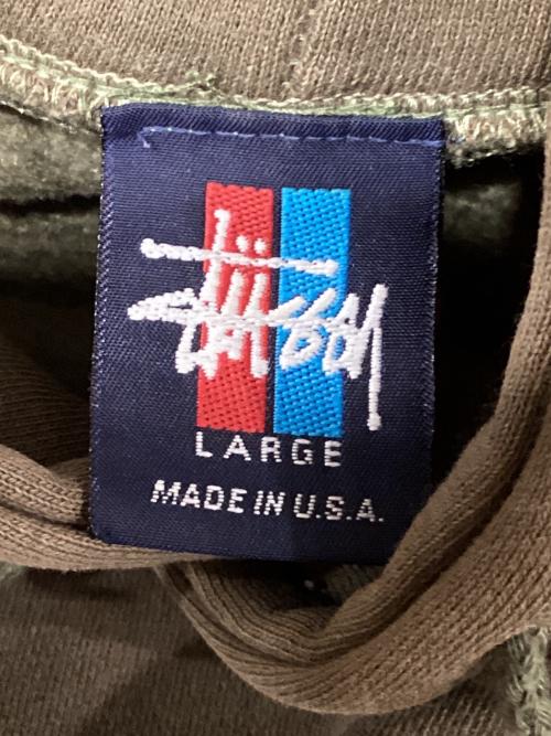 stussy（ステューシー）stussy (ステューシー) 90ｓ WORLD TOURプルオーバーパーカー オリーブ サイズ:Lの古着・服飾アイテム
