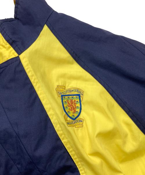 UMBRO（アンブロ）UMBRO (アンブロ) 90’S　 スコットランド代表　ナイロンジャケット ネイビー×イエロー サイズ:-の古着・服飾アイテム
