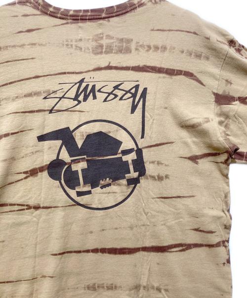 stussy（ステューシー）stussy (ステューシー) スケートマンTシャツ ベージュ サイズ:Lの古着・服飾アイテム