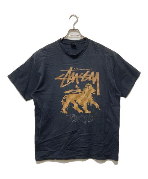 stussy（ステューシー）stussy (ステューシー) ラスタフラッグTシャツ ブラック サイズ:XLの古着・服飾アイテム