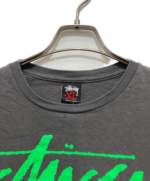 stussy（ステューシー）stussy (ステューシー) World Tribe スカルTシャツ / プリントTシャツ グレー サイズ:XLの古着・服飾アイテム