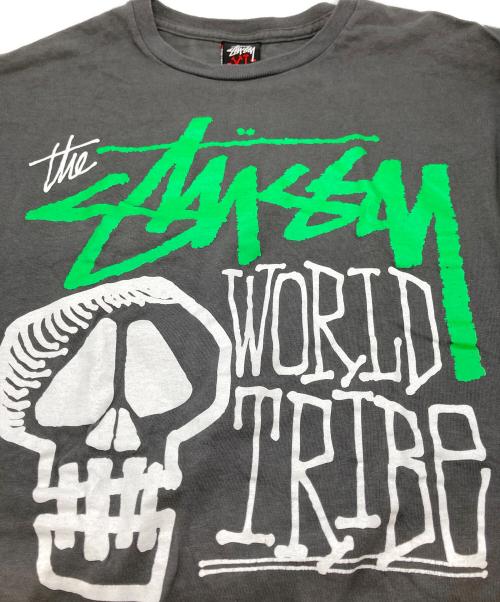 stussy（ステューシー）stussy (ステューシー) World Tribe スカルTシャツ / プリントTシャツ グレー サイズ:XLの古着・服飾アイテム
