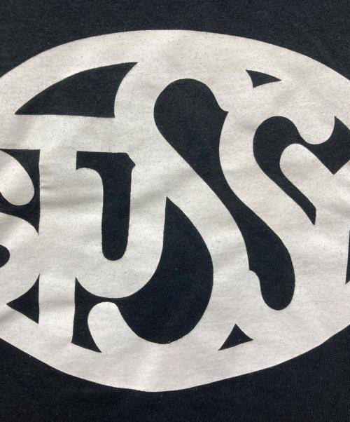 stussy（ステューシー）stussy (ステューシー) Eric Haze (エリック・ヘイズ) オーバルロゴプリントTシャツ ブラック サイズ:XLの古着・服飾アイテム