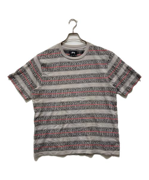 stussy（ステューシー）stussy (ステューシー) MTV (エムティービー) ジャガードロゴテープTシャツ グレー サイズ:XLの古着・服飾アイテム