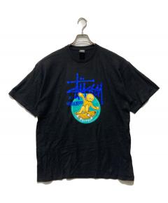中古・古着通販】stussy (ステューシー) ラグランキャラクターTシャツ 中古・古着通販】stussy (ステューシー) ラグランキャラクターTシャツ