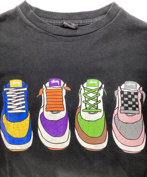 stussy（ステューシー）stussy (ステューシー) スニーカープリント長袖Tシャツ / ロングスリーブカットソー ブラック サイズ:XLの古着・服飾アイテム