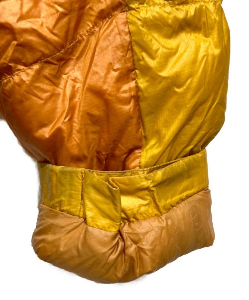 mont-bell（モンベル）mont-bell (モンベル) アルパインダウンパーカ ダウンジャケット イエロー×オレンジ サイズ:Sの古着・服飾アイテム