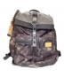TUMI（トゥミ）の古着「カモ柄リュック」｜カーキ