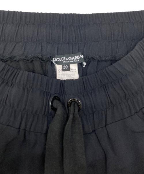 DOLCE & GABBANA（ドルチェ＆ガッバーナ）DOLCE & GABBANA (ドルチェ＆ガッバーナ) サイドテープロゴトラックパンツ ブラック サイズ:50の古着・服飾アイテム