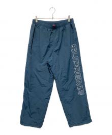 SUPREME（シュプリーム）の古着「23FWスペルアウト エンブロイダード トラックパンツ」｜グリーン