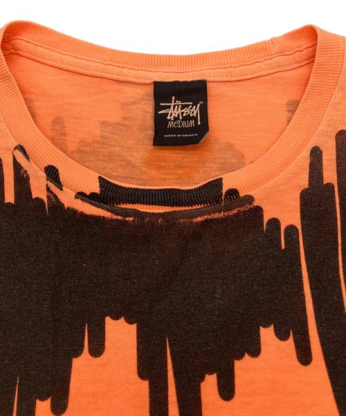 stussy（ステューシー）stussy (ステューシー) プリントTシャツ オレンジ サイズ:Mの古着・服飾アイテム