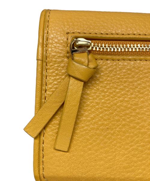 TORY BURCH（トリーバーチ）TORY BURCH (トリーバーチ) スマートフォンウォレットポーチ イエローの古着・服飾アイテム