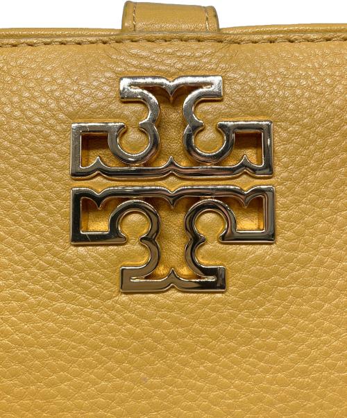 TORY BURCH（トリーバーチ）TORY BURCH (トリーバーチ) スマートフォンウォレットポーチ イエローの古着・服飾アイテム