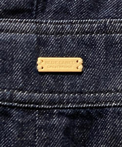 BLUE LABEL CRESTBRIDGE（ブルーレーベルクレストブリッジ）BLUE LABEL CRESTBRIDGE (ブルーレーベルクレストブリッジ) メタルロゴプレートデニムジャンパースカート ネイビー サイズ:38の古着・服飾アイテム