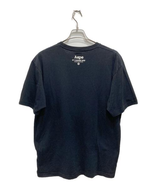 Aape BY A BATHING APE（エーエイプ バイ アベイシングエイプ）Aape BY A BATHING APE (エーエイプ バイ アベイシングエイプ) プリントTシャツ ブラック サイズ:XLの古着・服飾アイテム