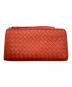BOTTEGA VENETA（ボッテガベネタ）の古着「L字ファスナーイントレチャート長財布」｜オレンジ