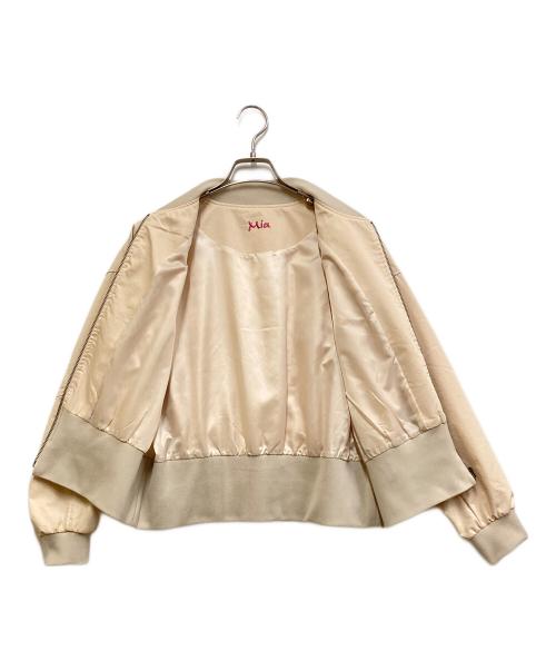 Mia asterism（ミーアアステリズム）Mia asterism (ミーアアステリズム) 裾リブロゴスタジャン ベージュ サイズ:38の古着・服飾アイテム