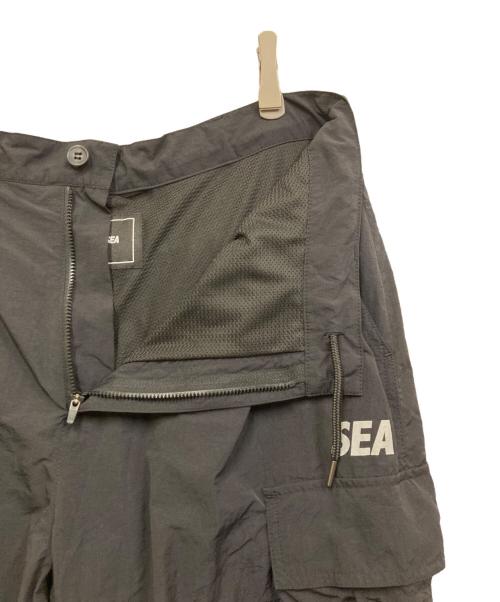 WIND AND SEA（ウィンダンシー）WIND AND SEA (ウィンダンシー) ロゴプリントカーゴパンツ ブラック サイズ:XLの古着・服飾アイテム