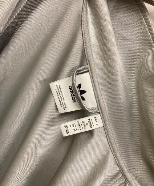 adidas（アディダス）adidas (アディダス) オーバーサイズ ファイヤーバード トラックトップ ライトオニキス シルバー サイズ:Mの古着・服飾アイテム