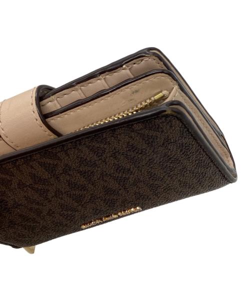 MICHAEL KORS（マイケル・コース）MICHAEL KORS (マイケル・コース) MK チャーム シグネチャー ミディアム タブ L ジップ ウォレット ブラウンの古着・服飾アイテム