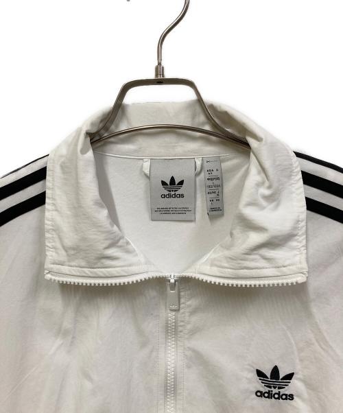 adidas（アディダス）adidas (アディダス) アディカラー ウーブン ファイヤーバード トラックトップ ホワイト×ブラック サイズ:XLの古着・服飾アイテム