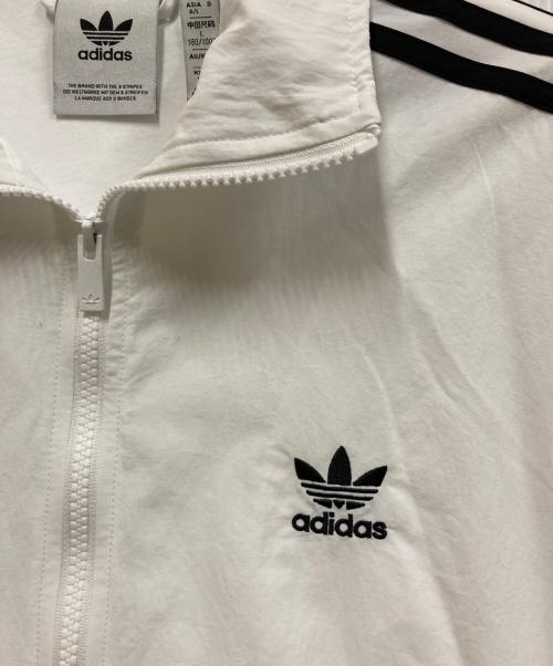 adidas（アディダス）adidas (アディダス) アディカラー ウーブン ファイヤーバード トラックトップ ホワイト×ブラック サイズ:XLの古着・服飾アイテム