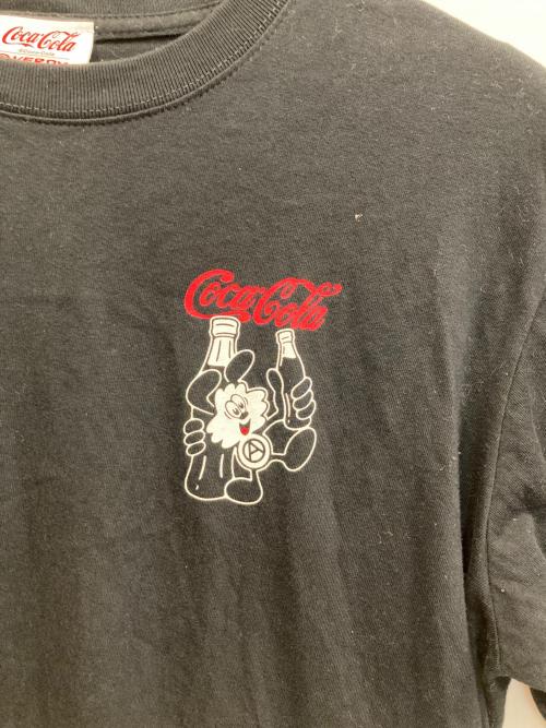 VERDY（ヴェルディ）verdy (ヴェルディ) Coca Cola (コカコーラ) s/sプリントTシャツ ブラック サイズ:Ｌの古着・服飾アイテム