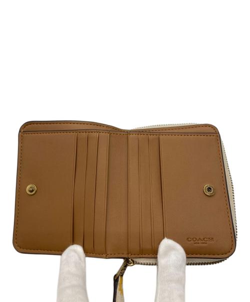 COACH（コーチ）COACH (コーチ) コンパクトラウンドジップウォレット ホワイト×イエローの古着・服飾アイテム