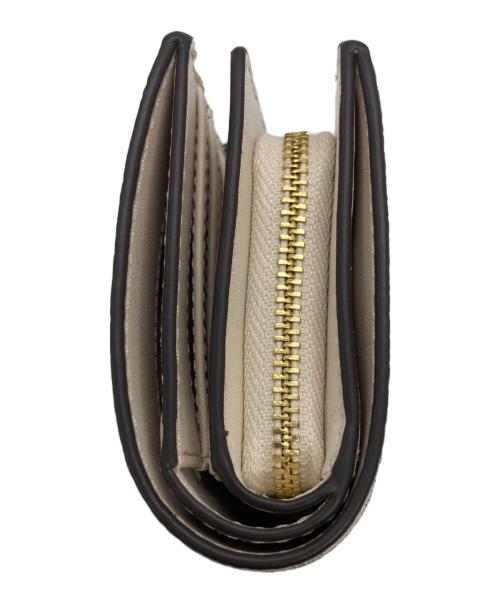 MICHAEL KORS（マイケルコース）MICHAEL KORS (マイケルコース) ビルフォールド MKシグネチャー ウォレット 二つ折り財布 ホワイトの古着・服飾アイテム