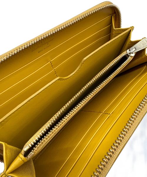 Salvatore Ferragamo（サルヴァトーレ フェラガモ）Salvatore Ferragamo (サルヴァトーレ フェラガモ) ガンチーニラウンド長財布 イエローの古着・服飾アイテム