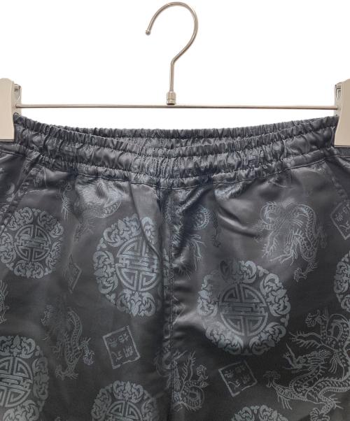 X-GIRL（エックスガール）X-GIRL (エックスガール) OPENING CEREMONY (オープニングセレモニー) 総柄パンツ ブラック サイズ:Sの古着・服飾アイテム