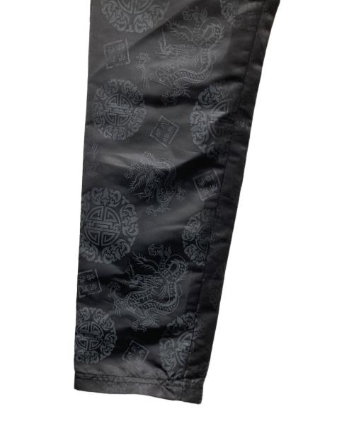 X-GIRL（エックスガール）X-GIRL (エックスガール) OPENING CEREMONY (オープニングセレモニー) 総柄パンツ ブラック サイズ:Sの古着・服飾アイテム