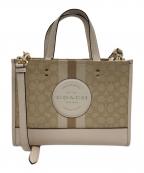 COACHコーチ）の古着「2WAYバッグ/デンプシー キャリーオール シグネチャー」｜ベージュ