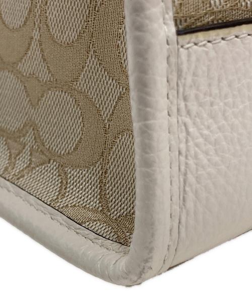 COACH（コーチ）COACH (コーチ) 2WAYバッグ/デンプシー キャリーオール シグネチャー ベージュの古着・服飾アイテム