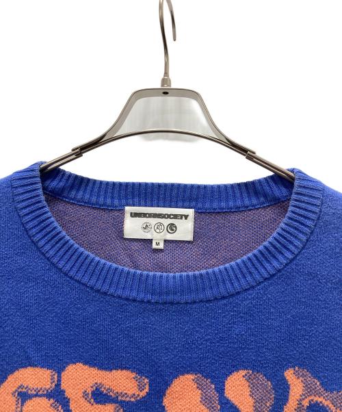 UNBORN SOCIETY（アンボーン ソサイエティー）UNBORN SOCIETY (アンボーン ソサイエティー) グラフィックニット ブルー サイズ:Mの古着・服飾アイテム