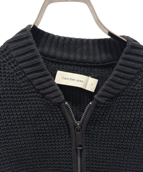 Calvin Klein Jeans（カルバンクラインジーンズ）Calvin Klein Jeans (カルバンクラインジーンズ) ニットボンバージャンパーカーディガン ブラック サイズ:Sの古着・服飾アイテム