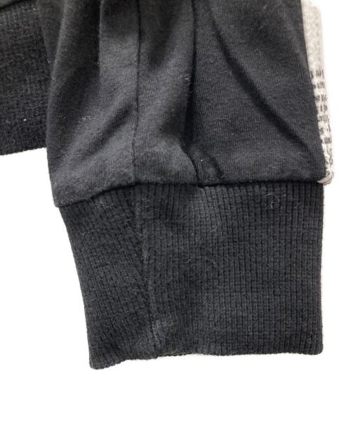 JOHN GALLIANO（ジョンガリアーノ）JOHN GALLIANO (ジョンガリアーノ) ニュースペーパー 切替ジップパーカー ブラック サイズ:Lの古着・服飾アイテム