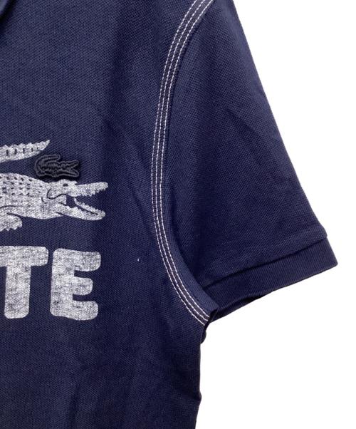 LACOSTE（ラコステ）LACOSTE (ラコステ) ヴィンテージプリントポロシャツ ブラック サイズ:S 未使用品の古着・服飾アイテム