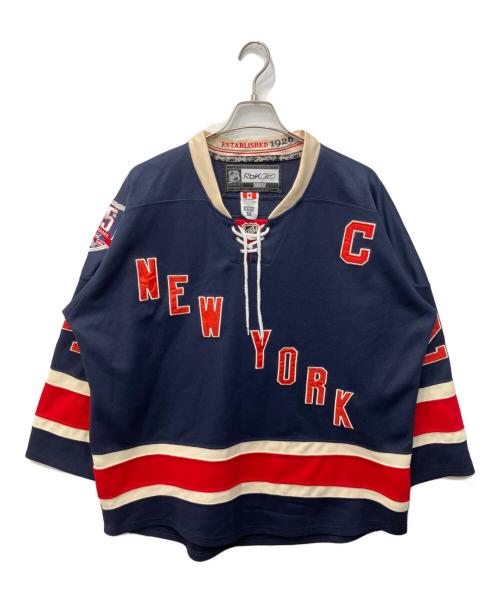 REEBOK（リーボック）REEBOK (リーボック) NHL (エヌエイチエル) ニューヨーク・レンジャーズ ホッケーシャツ ネイビー サイズ:50の古着・服飾アイテム