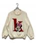 KITH（キス）の古着「Kith For Mickey & Friends Minnie K Crewneck Sweater 'Sandrift'/キスフォーミッキーアンドフレンズミッキークルーネックスウェットサンドリフト」｜アイボリー