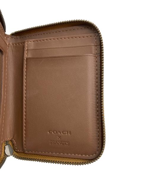 COACH（コーチ）COACH (コーチ) PEANUTS (ピーナッツ) ラウンドジップウォレット イエローの古着・服飾アイテム