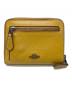 COACH（コーチ）の古着「ラウンドジップウォレット」｜イエロー