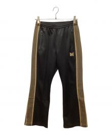 Needles（ニードルズ）の古着「ブーツカットトラックパンツ」｜ゴールド×ブラック