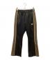 Needles（ニードルズ）の古着「ブーツカットトラックパンツ」｜ゴールド×ブラック