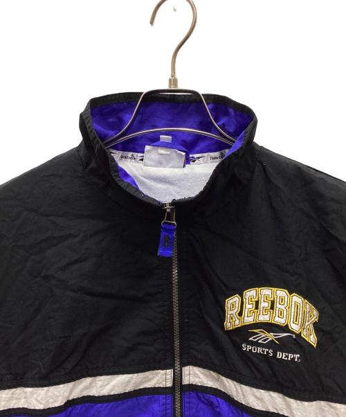 REEBOK（リーボック）REEBOK (リーボック) ナイロンジャケット ブラック×ブルー サイズ:XLの古着・服飾アイテム
