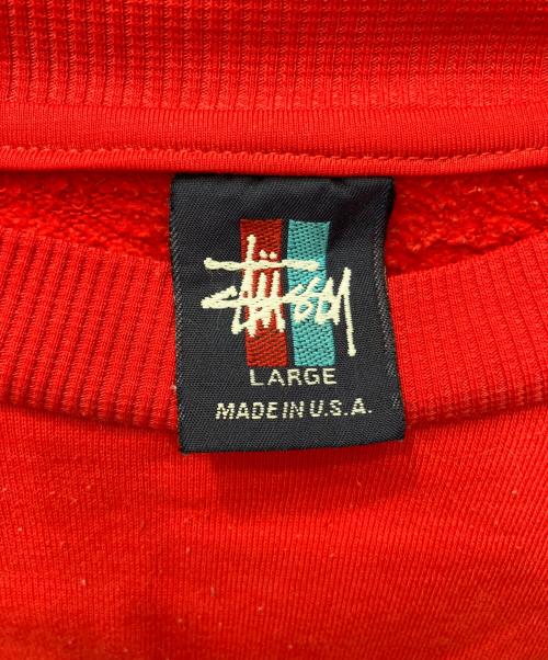 stussy（ステューシー）stussy (ステューシー) シャドーマンバックプリントクルーネックスウェット レッド サイズ:Lの古着・服飾アイテム