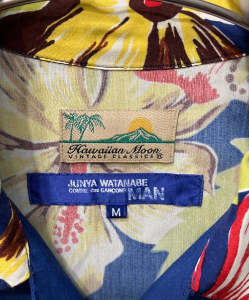 COMME des GARCONS JUNYA WATANABE MAN（コム デ ギャルソン ジュンヤ ワタナベ マン）COMME des GARCONS JUNYA WATANABE MAN Hawaiian moon (ハワイアンムーン) 背面ブラックレイヤーオーバープリントアロハシャツ ブルー サイズ:Mの古着・服飾アイテム