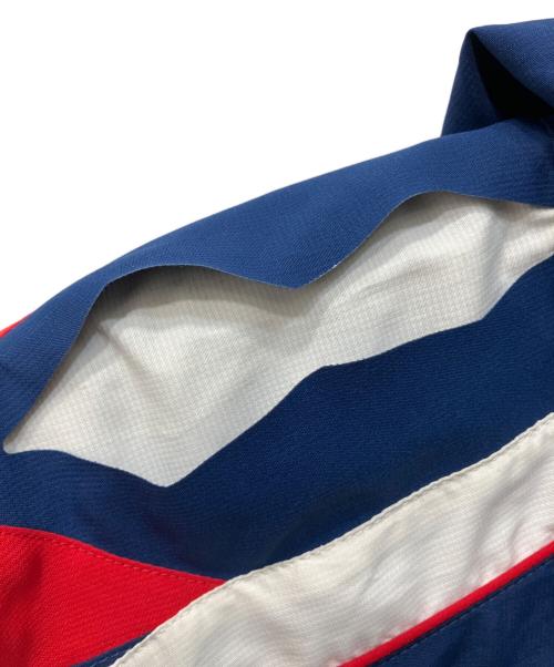 UMBRO（アンブロ）UMBRO (アンブロ) スラッシュデザインワッペン付きウインドブレーカー ネイビー サイズ:Lの古着・服飾アイテム