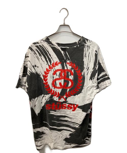 stussy（ステューシー）stussy (ステューシー) オールオーバープリントTシャツ ホワイト×ブラック サイズ:Lの古着・服飾アイテム