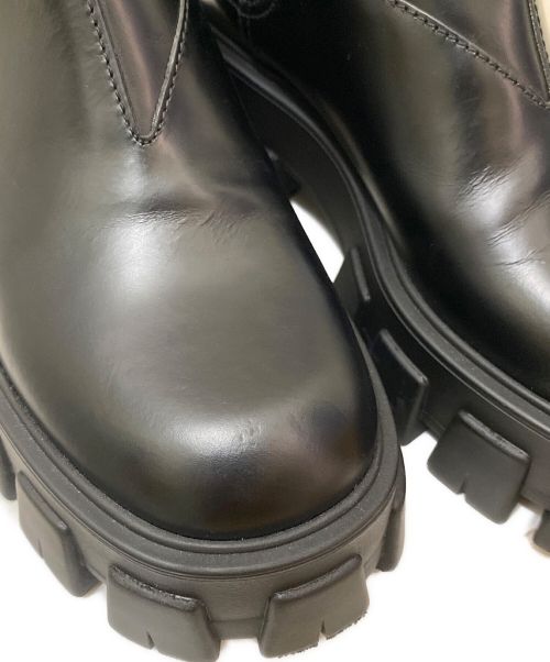 PRADA（プラダ）PRADA (プラダ) モノリスブラッシュドレザーアンクルブーツ ブラック サイズ:36 1/2の古着・服飾アイテム